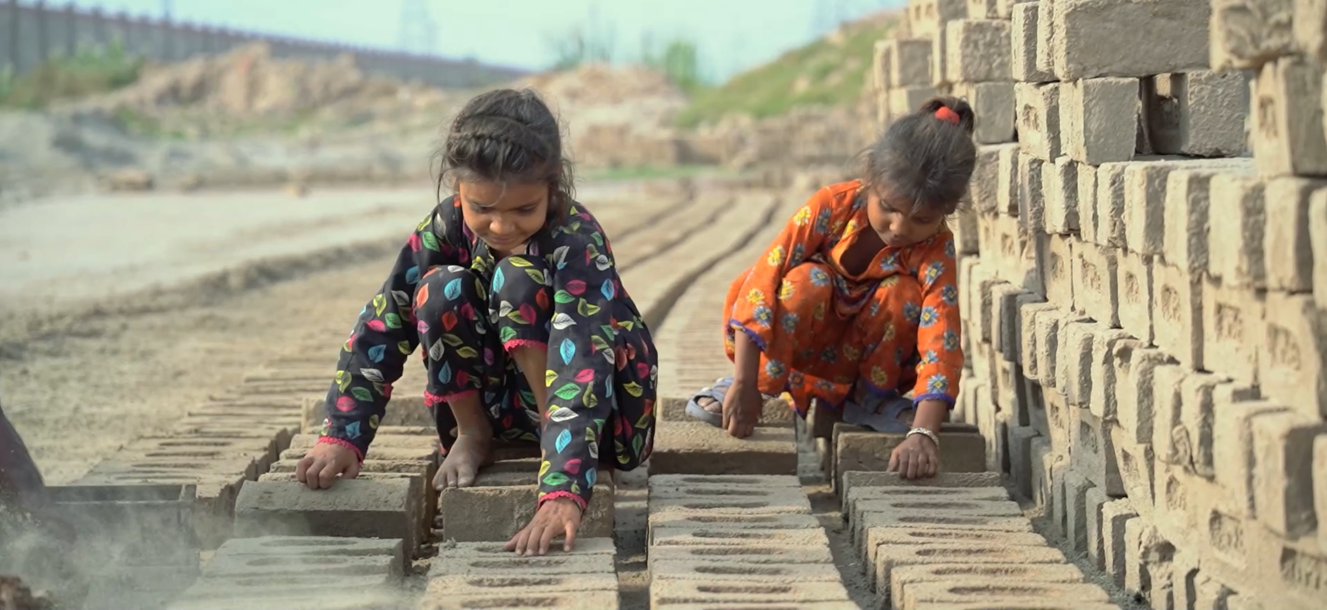 Children in Pakistan working at a brick kiln